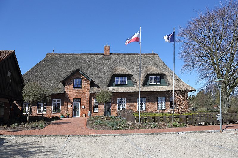 Ein grün blaues Wappen mit Schriftzug SG Hohenfelde