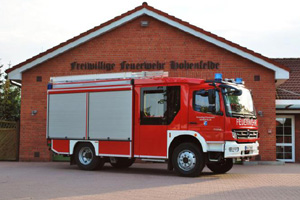 Ein grün blaues Wappen mit Schriftzug SG Hohenfelde